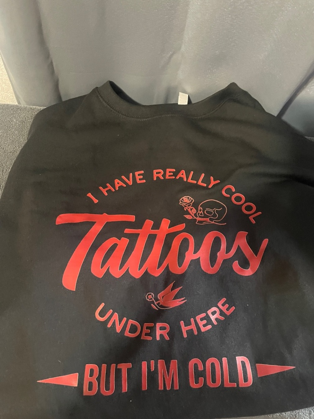 Black Graphic Sweatshirt with Red 'Tattoos' Slogan